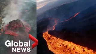 La Palma volcano: Drone sweeps over sizzling lava stream, huge molten boulder slides down side