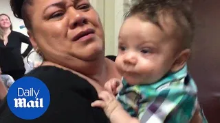 Heartwarming moment woman meets grandson for the first time