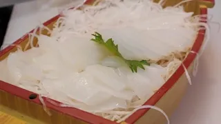 Japan Seafood cutting and processing giant cuttlefish, sashimi