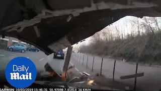 Heart-stopping moment car is CRUSHED by roof during a storm