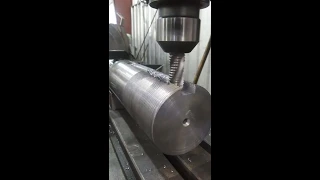 Milling a keyway in a shaft.