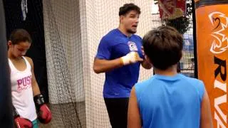 UFC heavyweight Frank Mir takes time out of his workout to share boxing tips with his kids