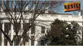 Greenpeace activists climb crane