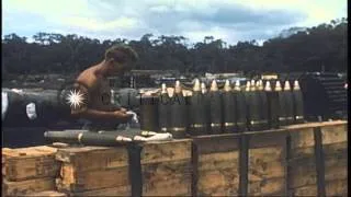 A US soldier prepares powder charges on a 105 mm howitzer and works on shells at ...HD Stock Footage