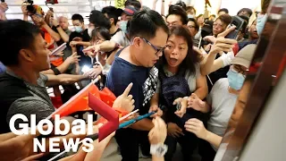 Hong Kong protests: Pro and anti-government demonstrators clash in shopping mall