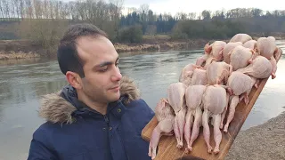 GRILLED WILD QUAIL ON A FIRE NEAR THE  BEAUTIFUL  RIVER