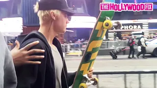 Justin Bieber Ditches Hailey On A Skateboard & She Falls Trying To Catch Up To Him In Times Square
