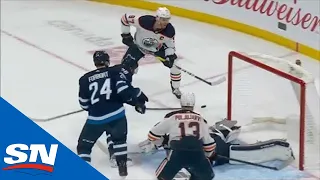 Connor McDavid Chips Puck Over Connor Hellebuyck For Oilers Goal