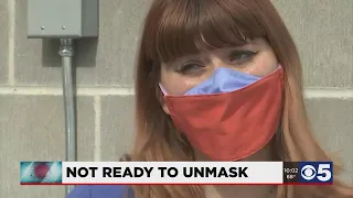 Many locals choosing masks despite government loosening rules