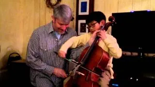 Papa and son play cello