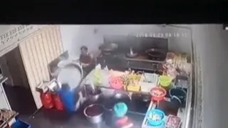 CCTV footage of boiling oil pouring into a man