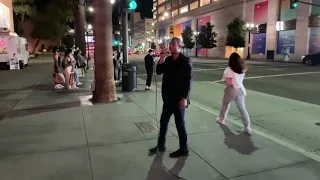 HOMELESS WOMAN TAKES THE MIC FROM STREET PREACHER TO SING