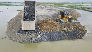 Nice Extreme Dump Truck Transport Stone with Operator Bulldozer Push Stone Building Road On Water