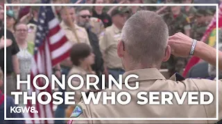 Scouts of America place flags to honor veterans at Willamette National Cemetery