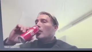 Mads Mikkelsen drinks a coke....