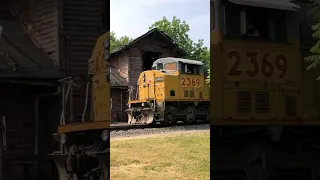 Big mainline locomotives pass an abandoned train station on the I&O shortline!