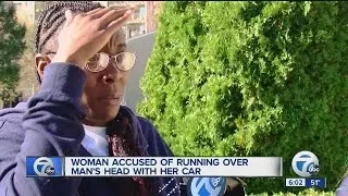 Woman accused of running over man's head with her car