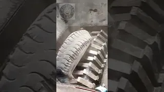 Shredder machine shredding truck tire， crushing things for recycling, satisfying video, asmr