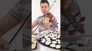 Nikocado avocado playing a violin