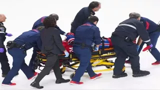 Montreal Canadiens' Phillip Danault taken off ice on stretcher after being hit in head with puck