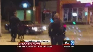 Woman shot in back at GR liquor store