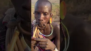 A woman from the Suri Tribe  demonstrates how to insert and remove a lip plate. #shorts #ethiopia