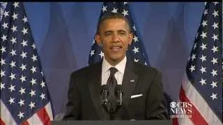 "Four more years" chant makes Obama blush