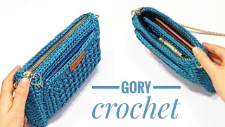 Crochet bag with an inner pocket and a front pocket for a mobile phone