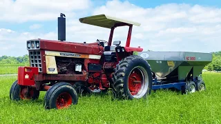 International 966 Spreading Fertilizer on Hay Fields