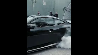 blacked out bmw m power burnout under tunnel in Moscow,Russia