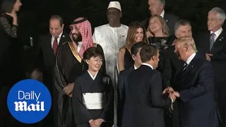 Macron and Trump greet each other with bizarre handshake at G20