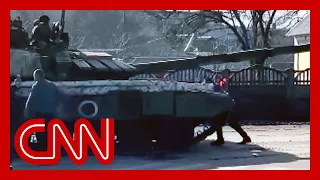 Video shows man try to stop Russian tank with his body