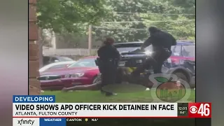 Video shows APD officer kick detainee in face