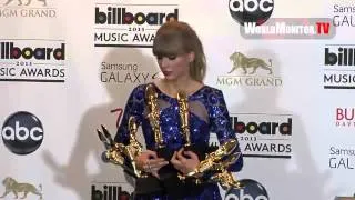 Taylor Swift poses with her Awards backstage at Billboard Music Awards 2013