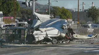 Police officers save injured pilot seconds before train crashes into plane