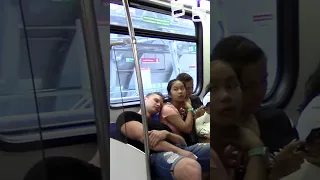 Sleeping on strangers in a train