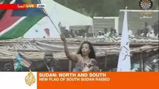 Juba crowd cheers South Sudanese flag raising