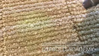 Live Carpet Dyeing of multi-color beige carpet with green spots.