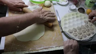 Gesture of rolling dough on cutting board in preparation of a delicious recipe