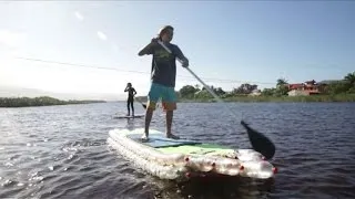 Plastic bottles used to make paddle boards to clean Brazil beach