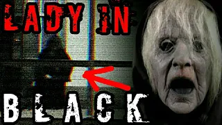 LADY IN BLACK - SEEN IN CREEPY WITCH CAMP AT NIGHT !