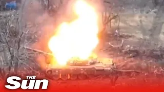 Russian tank explodes into pieces as Ukrainian drone drops bomb