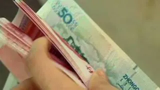 Yuan peg to dollar loosened