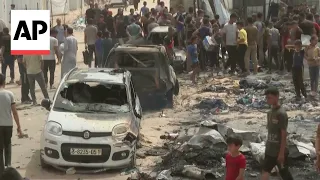 Mourners identify their loved ones after Israeli airstrike hits Rafah refugee camp in Gaza