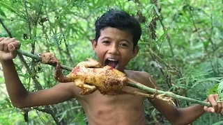 Cooking chicken on a rock in forest - hunting wild chicken then cooking two chicken in forest