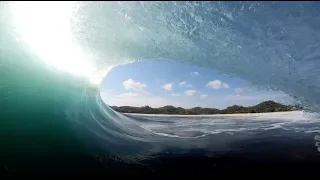 Surfing in a remote paradise in indonesia.