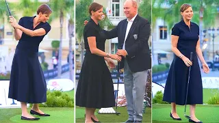 Albert And Charlene Of Monaco Happily Exchange A Tender Kiss At A Golf Tournament