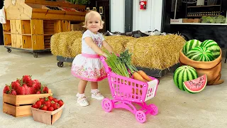 Alice and Mom learn how to harvest strawberries and vegetables at the farm