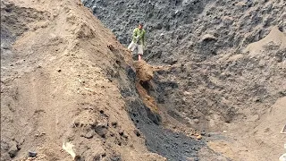 You have to take the trouble to dig into the cliffs to get black sand