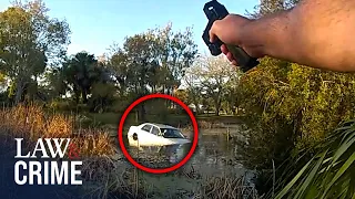 Bodycam: Accused Bank Robber Crashes into Swamp, Gets Shot at By Florida Cops
